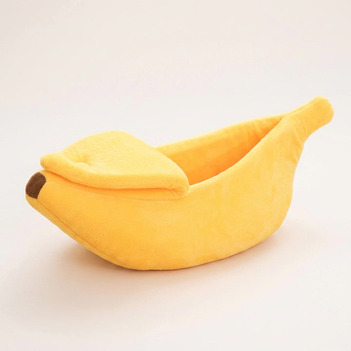 Wag Cabin BananaNap yellow banana-shaped cat bed on white background