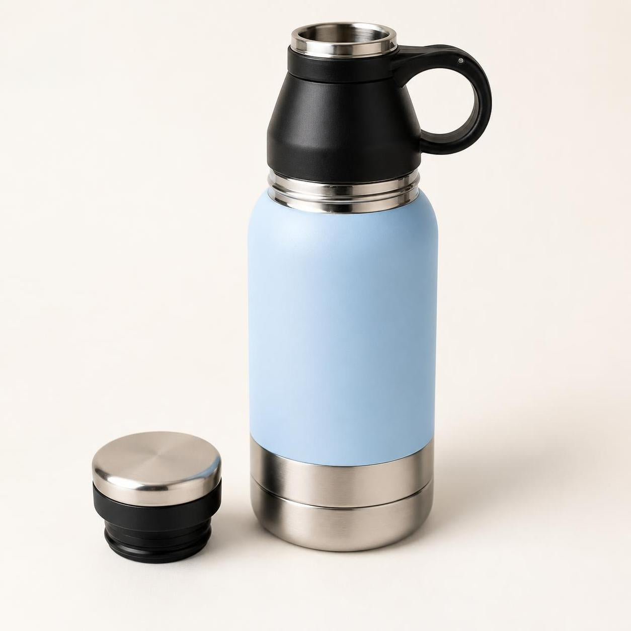 Wag Cabin TrailSip black handle and stainless cap detail on blue dog water bottle